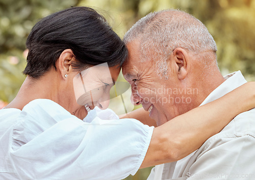Image of Senior couple, hug and forehead with smile for love, romance and embrace in relationship happiness in the outdoors. Happy mature man and woman hugging, smiling and romantic bonding together in nature