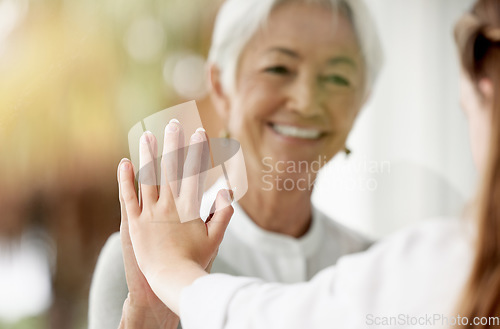 Image of Family, covid and grandma with child at window during quarantine, care and love in pandemic. Social distance, safety and security for happy grandmother and girl touching hands on glass at home visit.