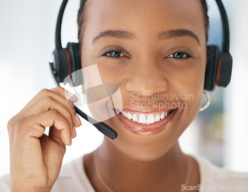 Image of Contact us, portrait and black woman in customer support in call center with a microphone for communication. Smile, telemarketing or happy insurance sales agent talking, speaking and helping clients