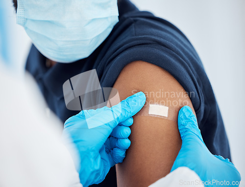 Image of Covid vaccine, plaster and doctor with patient for healthcare consultation, hospital first aid or covid 19 medical service. Corona virus, band aid and prevention vaccination for black man at clinc