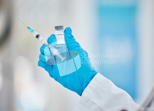 Image of Doctor hands, covid or vaccine bottle with syringe in hospital, clinic or pharmacy for health, wellness or medical compliance. Zoom, nurse or healthcare worker and covid 19 booster medicine or needle