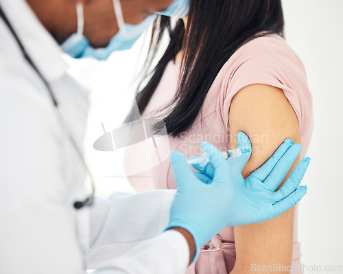 Image of Healthcare, covid vaccine and doctor with woman in a hospital for injection, immunity and health safety. Hands, nurse and corona vaccination by man health worker, needle and arm of patient in clinic