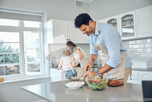 Image of Mom, dad and child cooking in kitchen together to prepare food for lunch supper and dinner. Family, helping hands and father cutting, slice and chop with mother and girl helping clean vegetables