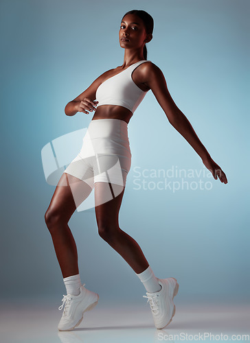 Image of Fitness, dancing and body of black woman balance in studio mock up for energy, workout training or wellness marketing portrait. Sports, athlete and dancer model exercise clothes, sneakers or fashion