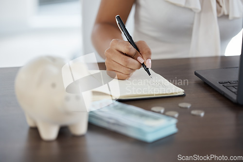 Image of Money, piggy bank and budget hands planning finance, writing in notebook for savings account or online laptop banking. Cash, coins and silver business woman financial accounting, investment or salary