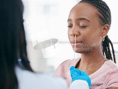 Image of Woman, doctor and covid test in a hospital for healthcare, research and innovation. Black woman, nose and corona swab with nurse in consultation room for compliance, results and health checkup