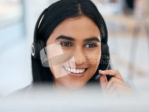 Image of Telemarketing, happy and woman networking in a call center talking, communication and speaking into microphone. Smile, contact us and Indian girl consulting and helping a client at customer services