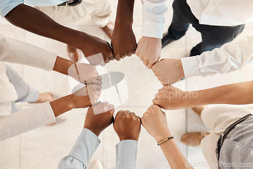 Image of Diversity, solidarity and hands of business people in circle for teamwork, collaboration and synergy for team building in a corporate office. Men and women group together for support, trust and power