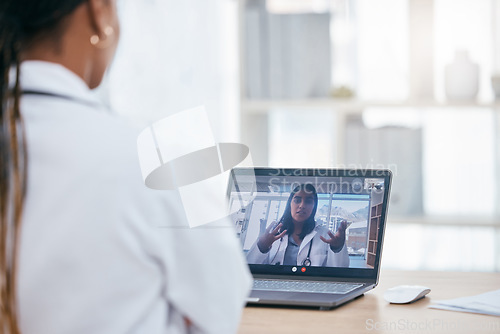 Image of Video call, discussion and doctors on an online meeting with laptop in the office of clinic. Healthcare workers talking about medicine, surgery and results in online medical conversation on computer.