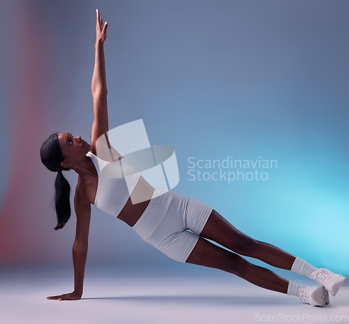 Image of Black woman, yoga fitness stretching and body wellness workout. Young athlete person, healthy lifestyle motivation and sports exercise muscle training for cardio on floor in blue background studio