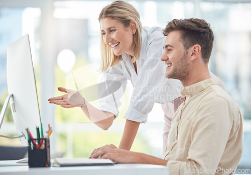 Image of Teamwork, training and human resources with a business woman helping a man colleague in the office. Computer, manager and mentor with a female employee working with a male coworker on a project