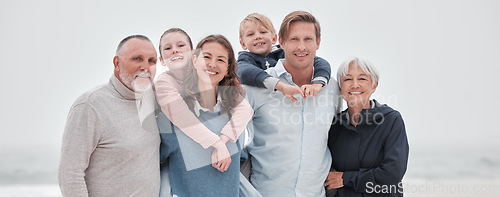 Image of Family, children and beach with parents, grandparents and kids outdoor together while on holiday or vacation. Travel, love and bonding with a senior man, woman and grandkids spending time on a coast