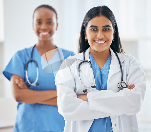 Image of Happy, portrait and women doctors in collaboration standing with crossed arms in hospital, Happiness, teamwork and leadership of healthcare workers with a smile after success consultation or surgery.