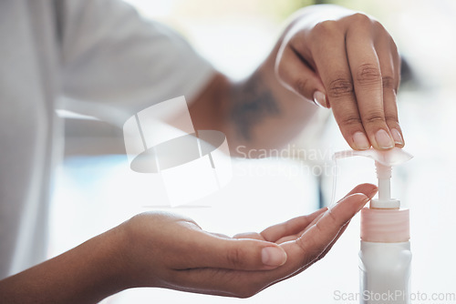 Image of Hands, cleaning and soap with a black woman washing for hygiene alone in the bathroom of her home. Health, bacteria and liquid with a female disinfecting or sanitizing her hand and skin in a house
