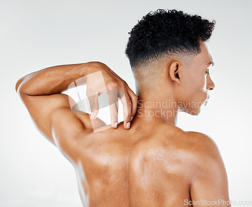 Image of Skincare, back muscle of man and strong for wellness, being confident with studio background. Rear view, male and fitness for body care, smooth and glow skin in bodybuilding or flex muscular anatomy.
