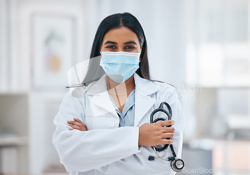 Image of Covid, medical and arms crossed with portrait of doctor with stethoscope for cardiology, virus and innovation in consulting room. Healthcare, help and medicine with woman in hospital for surgery