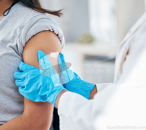 Image of Doctor, vaccine and patient arm, plaster and medical healthcare for flu shot, hpv and covid 19 risk in clinic hospital. Corona virus consulting, wellness service and bandage treatment for immunity