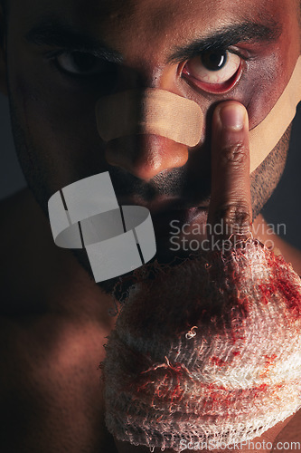 Image of Fight, blood and face of boxing man with first aid bandage after sports competition, crime conflict or violence. Training, fighting injury and shadow portrait of mma boxer with middle finger gesture