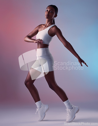 Image of Fitness, health and black woman stretching in studio portrait of healthy girl. Sports, exercise and form, motivation and balance for athlete cardio training for aerobics workout and woman in Jamaica.