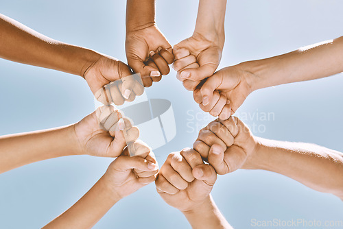 Image of Support, trust and solidarity fist hands circle with low angle for loyalty, mission and friends with cooperation. Connection, hope and community of people together for social commitment.