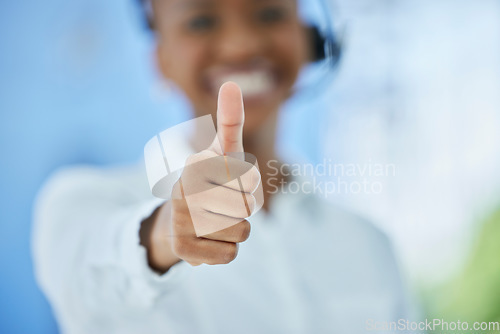 Image of Hand, thumbs up and woman for call center, ecommerce and telemarketing closeup. Hand, thank you and crm, sales and consultant by black woman happy, smile and excited to show contact us finger sign