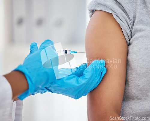 Image of Covid vaccine, needle and patient getting an injection from a doctor with gloves at a medical clinic. Healthcare, medicine and nurse giving a antibody vaccination to prevent coronavirus at a hospital