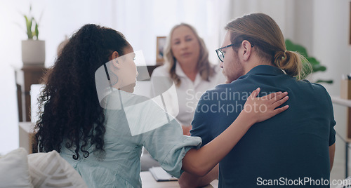 Image of Marriage, counselling and couple in therapist office giving comfort, care and talking to partner. Man and black woman with social worker or psychologist for problem, support and help in relationship