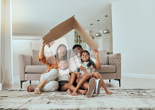 Image of Family, care and home insurance roof portrait with parents protecting house and children. Cardboard, covering and safety with parents keeping with kids safe. Love, mortgage and family house cover