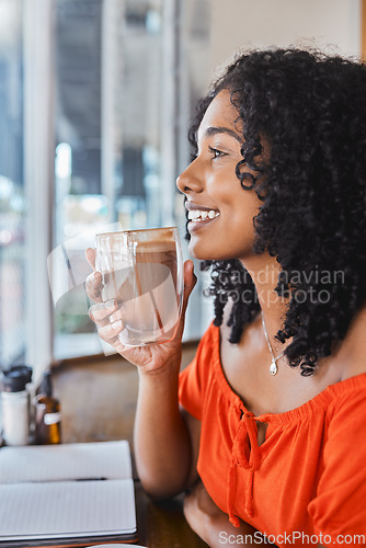 Image of Coffee shop, thinking and writing with a black woman freelancer drinking a beverage with an idea in mind. Cafe, book and creative with a young female customer enjoying freedom in a restaurant