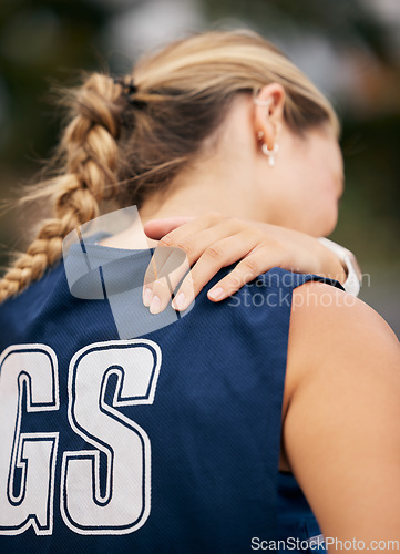 Image of Shoulder pain, sports injury and emergency of netball woman, athlete and stress of body workout or training exercise. Back pain, first aid accident and joint pain, body muscle problem or fitness risk