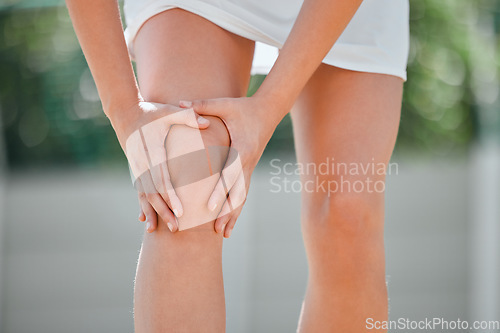 Image of Knee pain, tennis and sports with woman and injury on court with muscle, emergency and sprain. Fitness, workout and health with girl tennis player in outdoor with accident, inflammation and bruise