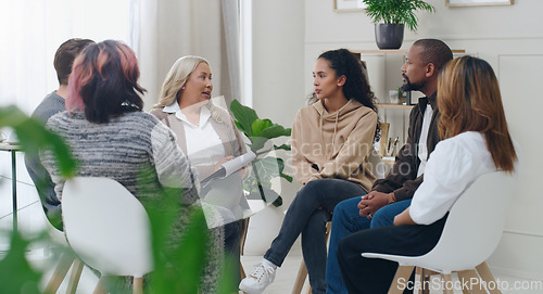 Image of Diversity, mental health and group therapy counseling support meeting, healthy conversation and wellness. Psychology counselor, psychologist help people and talk about anxiety, depression or stress