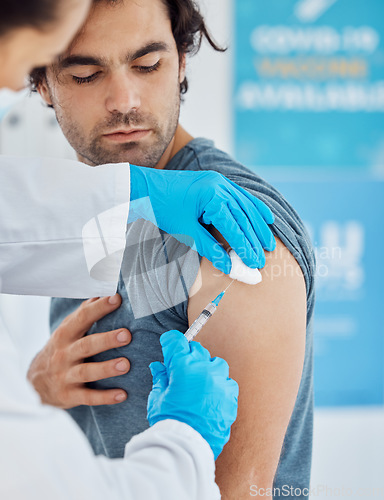 Image of Covid, vaccine and injection with a man patient getting his booster shot in a hospital with a doctor in gloves. Medicine, health and insurance with a male in a clinic to boost his immune system