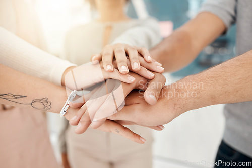Image of Collaboration, teamwork and hands of business people in office for motivation, unity and solidarity. Trust, support and group in huddle for targets, mission and goals, vision or success mindset.