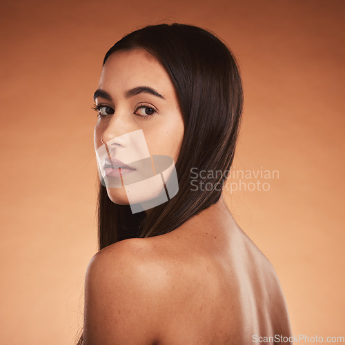 Image of Beauty, body and haircare portrait of a young woman posing for cosmetic treatment advertisement on studio background. Hairstyle, bodycare and health and wellness care for skin of hispanic female