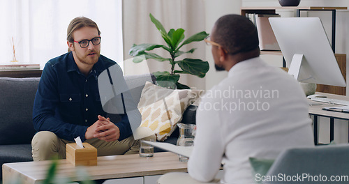 Image of Man, patient or talking to psychologist on sofa in mental health, depression or anxiety counselling therapy. Psychology, stress or wellness counseling therapy help for person in rehabilitation clinic