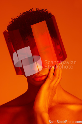 Image of Cyberpunk glasses, red neon and fashion model with creative futuristic style, fantasy lighting and sci fi mask. Future gen z aesthetic, beauty light creativity and face portrait of serious black man