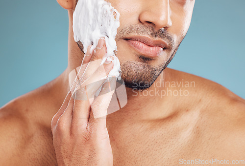 Image of Shaving cream, skincare and skin grooming of a black man busy with beauty and facial routine. Face health, wellness and cosmetic lotion treatment of a person with beard moisturizer and shave product