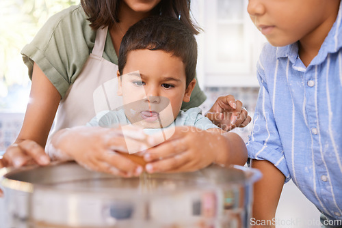 Image of Family, cooking and child learning about baking with eggs in home kitchen with mom teaching kid to bake. Boy, woman and sibling together while helping to cook a meal, cake or food for quality time