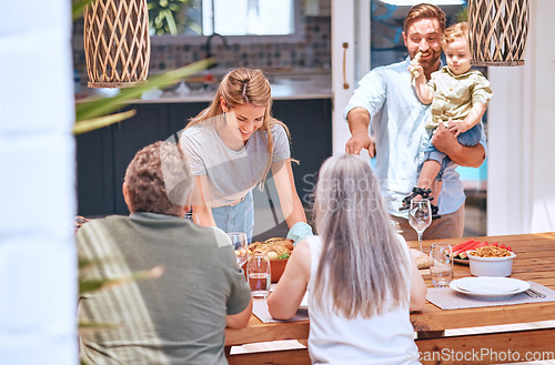 Image of Chicken, lunch and big family eating at a dining room table in their house with love, smile and celebration together. Food, happy and woman with a turkey dinner for senior parents, child and man