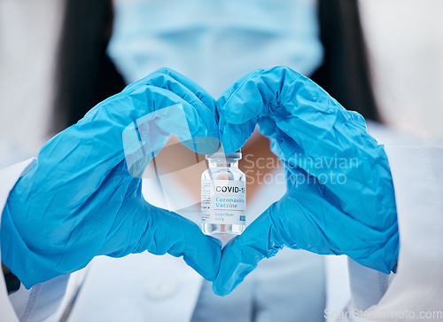 Image of Heart sign, covid vaccine and doctor hands with medicine bottle and serum for risk, healthcare and wellness safety. Medical worker, pharmaceutical innovation and scientist drug test cure of covid 19