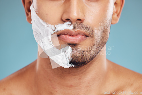 Image of Face, shaving and beauty cream man closeup of beard facial, wellness and grooming product advertising. Cosmetic, skincare and shave foam hygiene routine of male model with teal studio background.