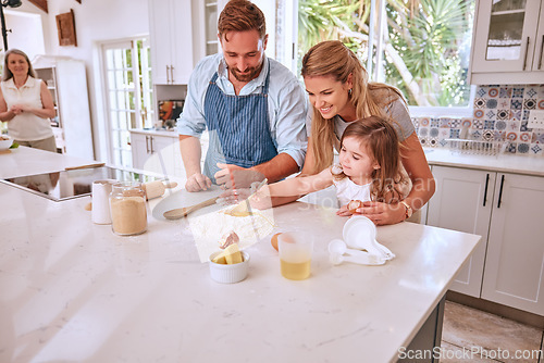 Image of Learning, family cooking and girl in kitchen with mom teaching child how to bake. Baking, education and happy parents enjoying time with kid, care or bonding and preparing food, egg and flour recipes