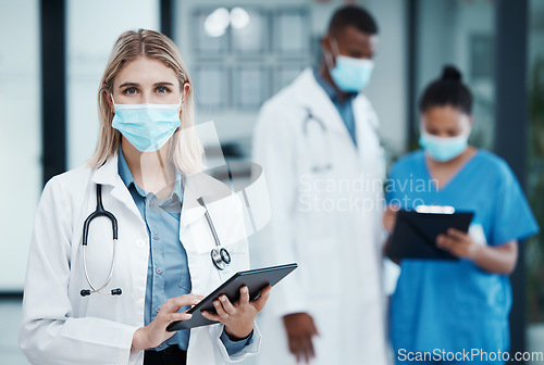 Image of Covid hospital, woman doctor and portrait of tablet research, wellness and medical planning in clinic. Young healthcare worker, face mask and digital app consulting for online test results in surgery