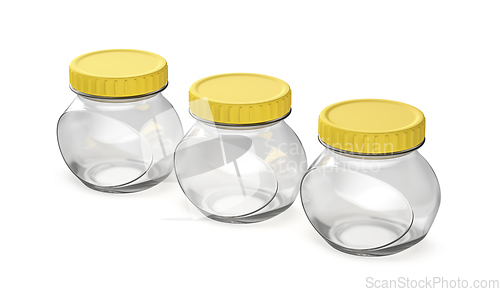 Image of Empty oval glass jars with yellow plastic lids