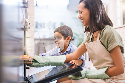 Image of Oven, home and mother baking with her child to teach him independence while bonding in kitchen. Happiness, fun and mom from Mexico cooking dinner with son while learning about food in family house.