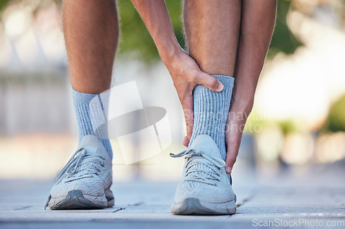 Image of Man, feet or ankle pain in running fitness, training or exercise in New York city, street or road. Zoom, personal trainer or runner with sports injury in legs from workout burnout or anatomy accident