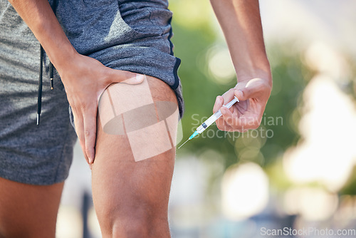 Image of Man with syringe, steroids in legs muscle and ban drugs injection with medicine addiction. Sports athlete cheating outdoor workout, illegal testosterone use in fitness and bodybuilder holding thigh