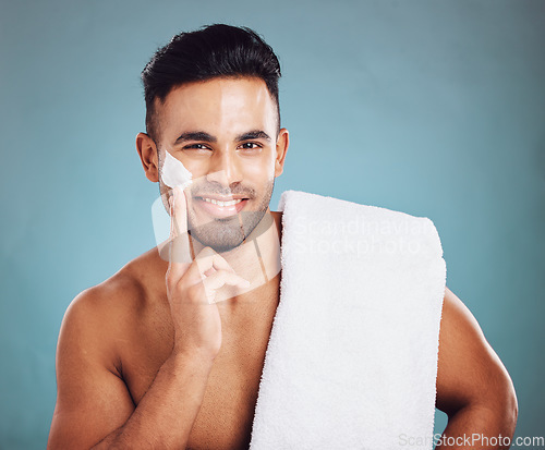 Image of Beauty, shaving and cream portrait of man happy with preparation for grooming, cleaning and facial hair removal. Hygiene cosmetic model with shave foam on face and smile in teal studio with mockup.