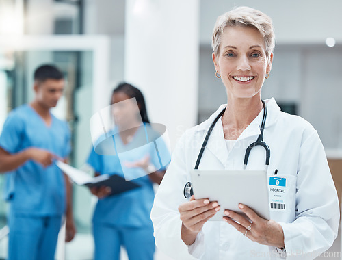 Image of Senior woman, doctor and tablet with smile for medical research, innovation and medicine at the hospital. Portrait of elderly female healthcare professional smiling with technology for Telehealth